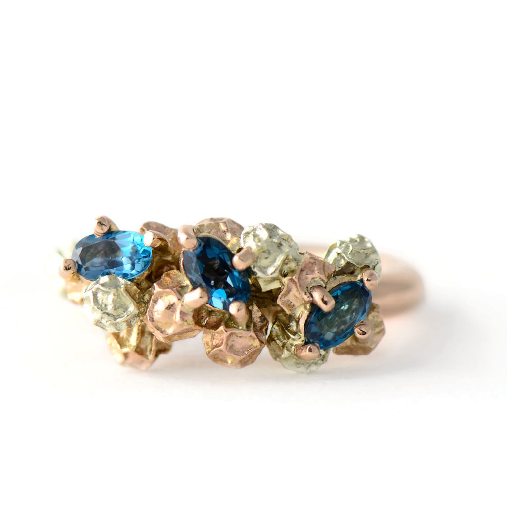rose gold and blue topaz  cluster ring 