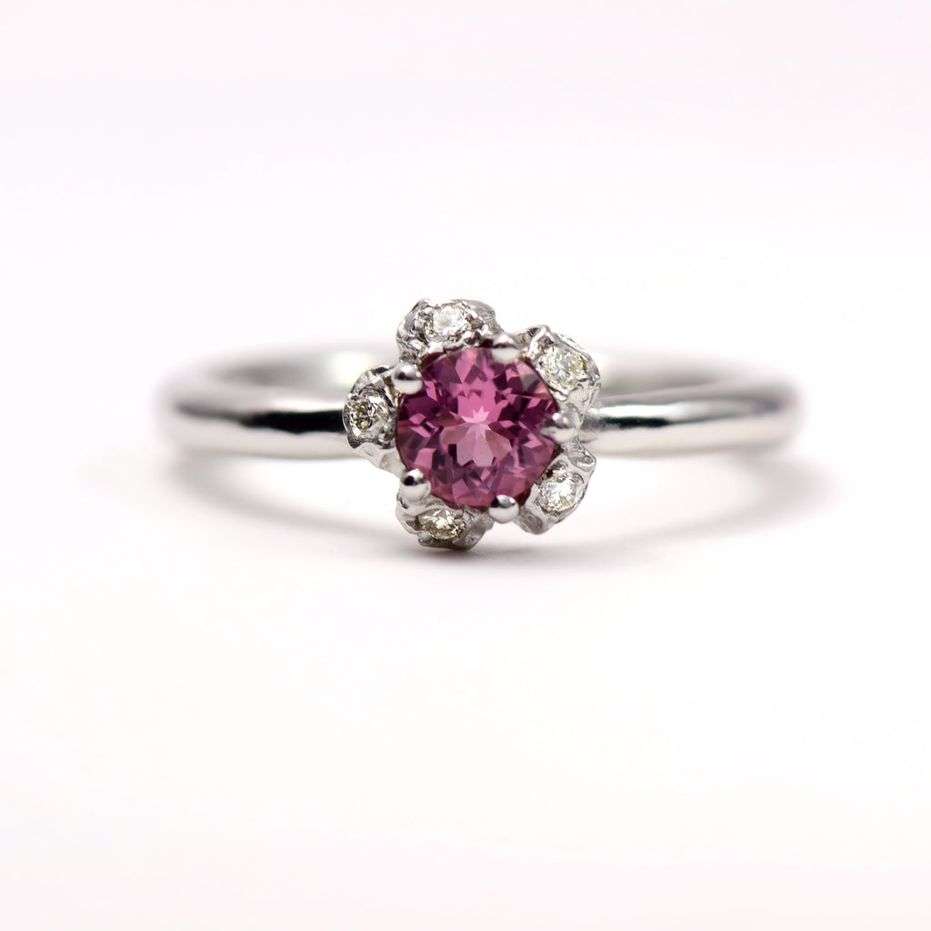 white gold , diamond and pink tourmaline engagement ring 