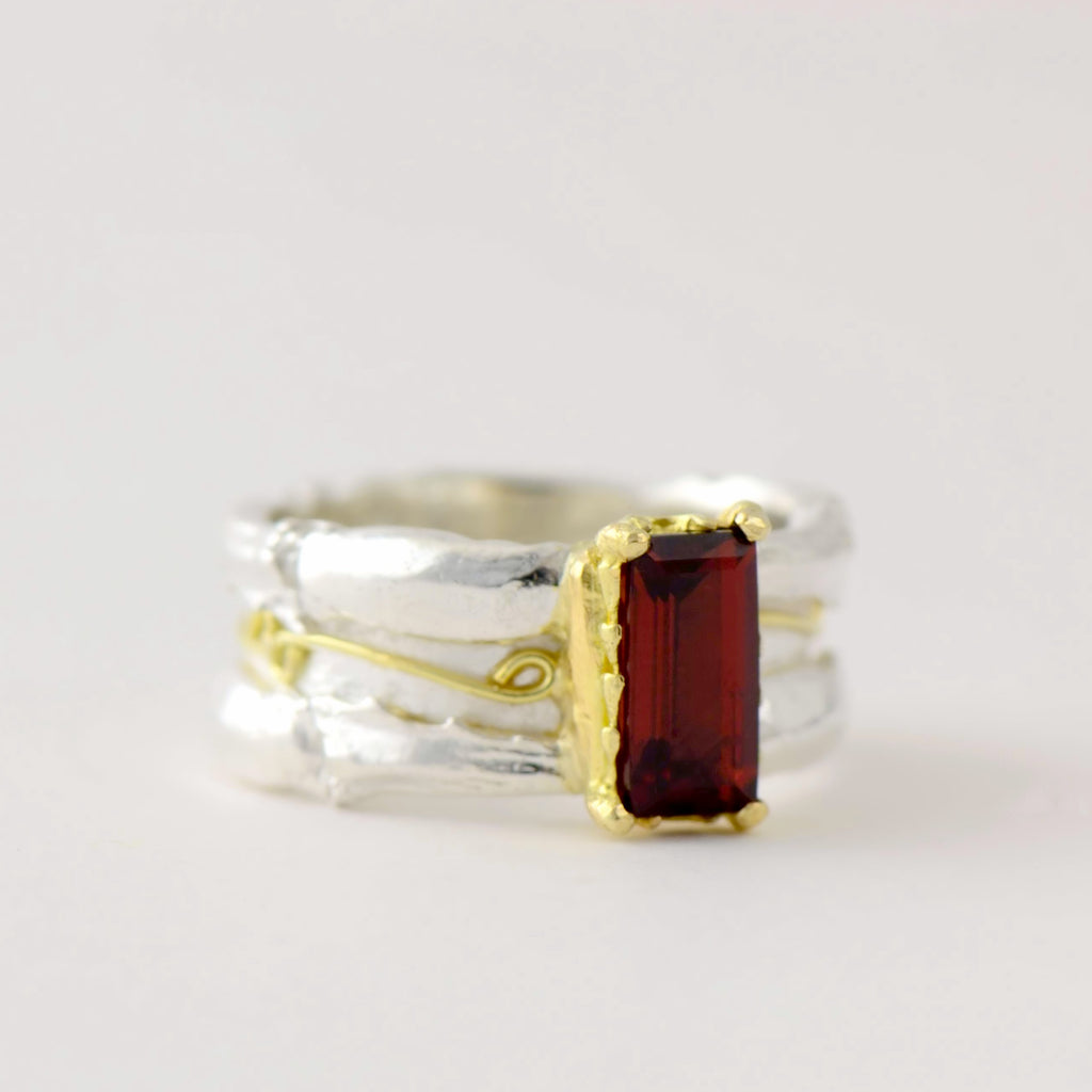 large garnet , gold and silver ring 