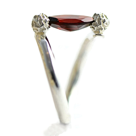Tension set ring with a marquise garnet 