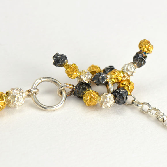 A silver and golden three peppercorn stick bracelet, fruit Bracelet Design