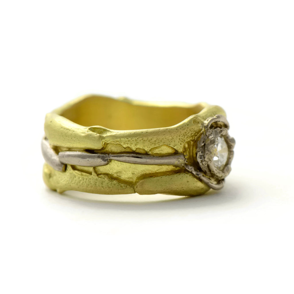 18 carat fairtrade gold ring with a bright diamond and the unique tropical insect texture
