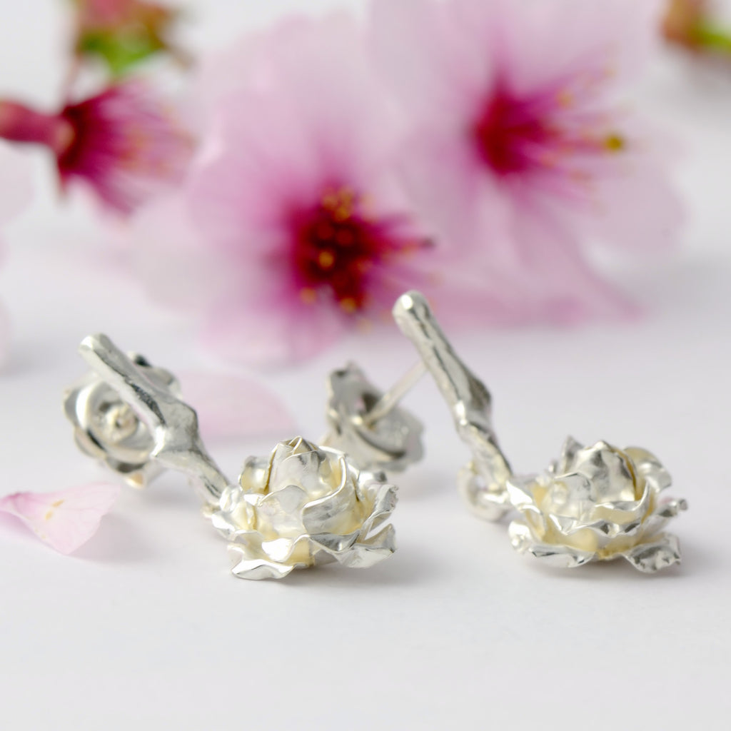 Small dangling rose stud earrings - 1 cm rose suspended by a delicate rose thorn