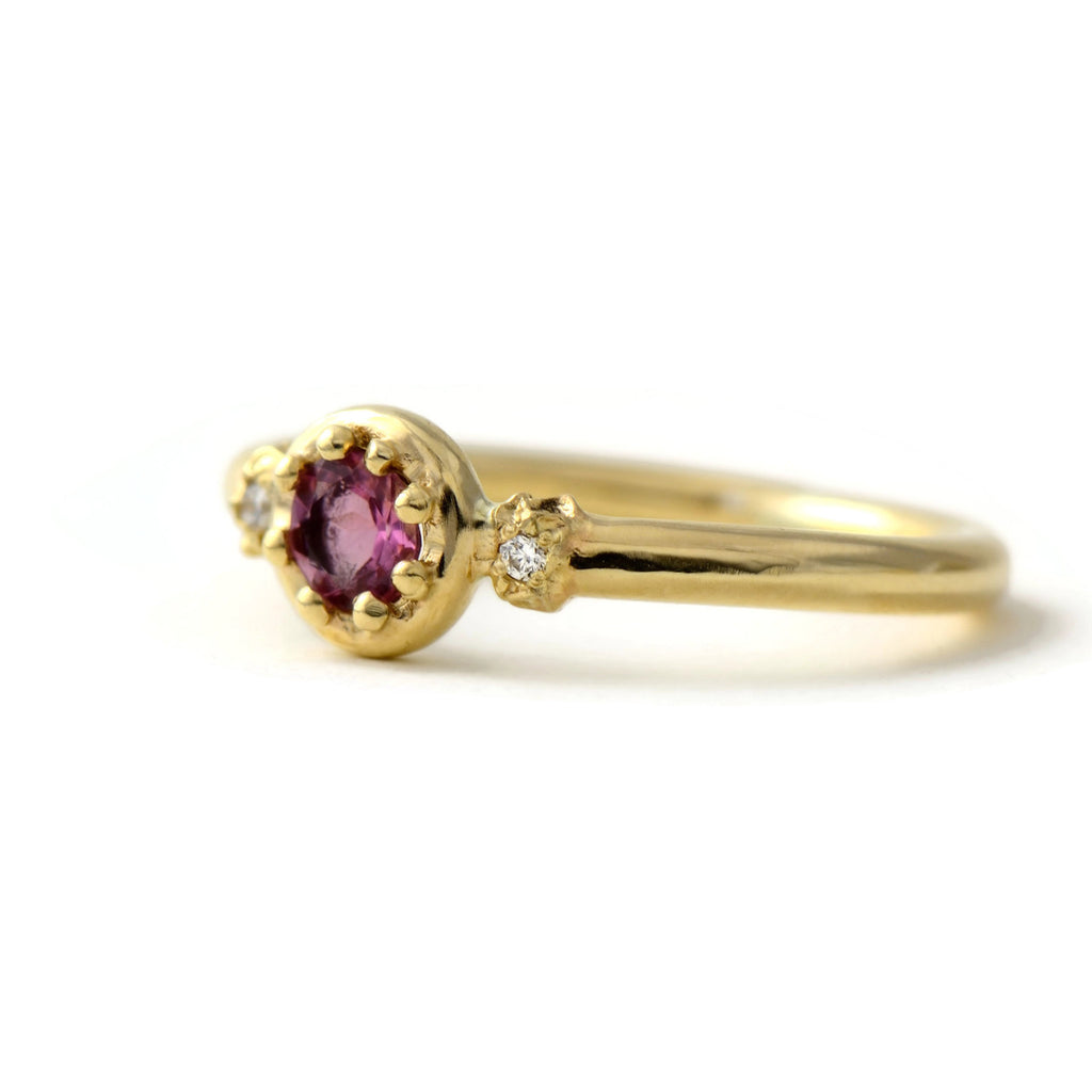 yellow gold and pink gemstone ring