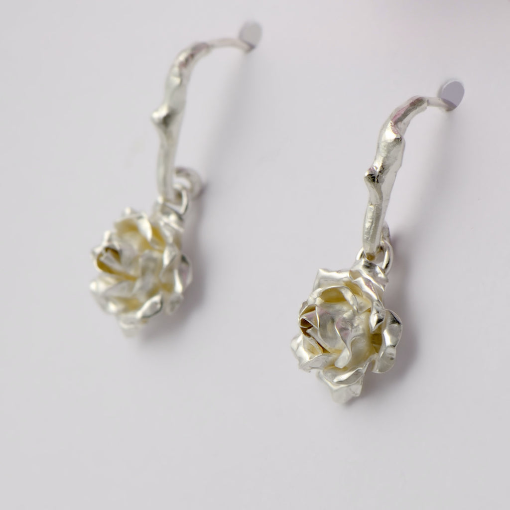 Small dangling rose stud earrings - 1 cm rose suspended by a delicate rose thorn