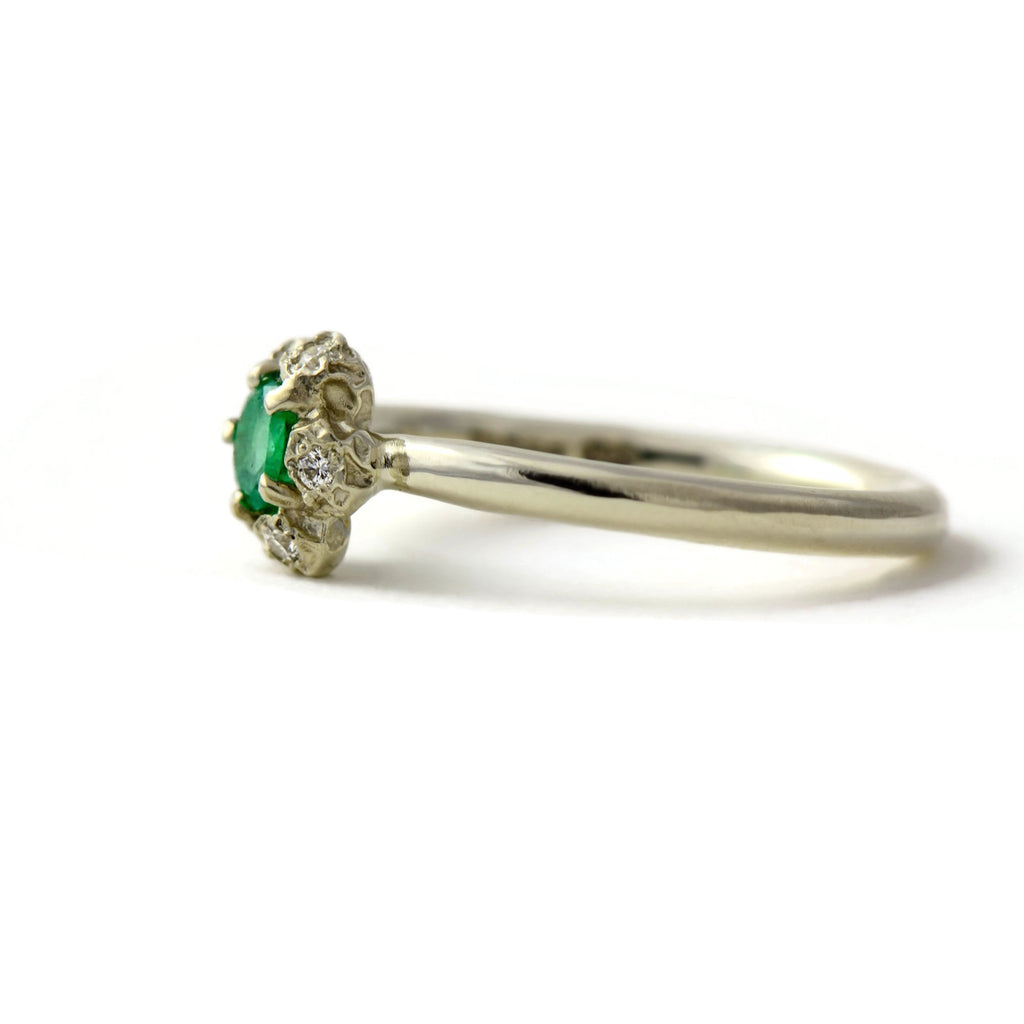Natural Colombian emerald solitaire engagement ring  with a diamond cluster set in gold peppercorn