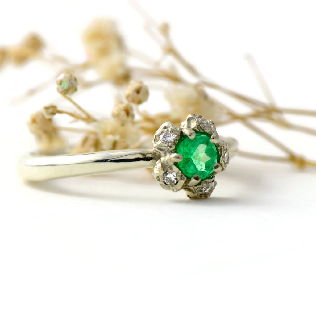 Natural Colombian emerald solitaire engagement ring  with a diamond cluster set in gold peppercorn