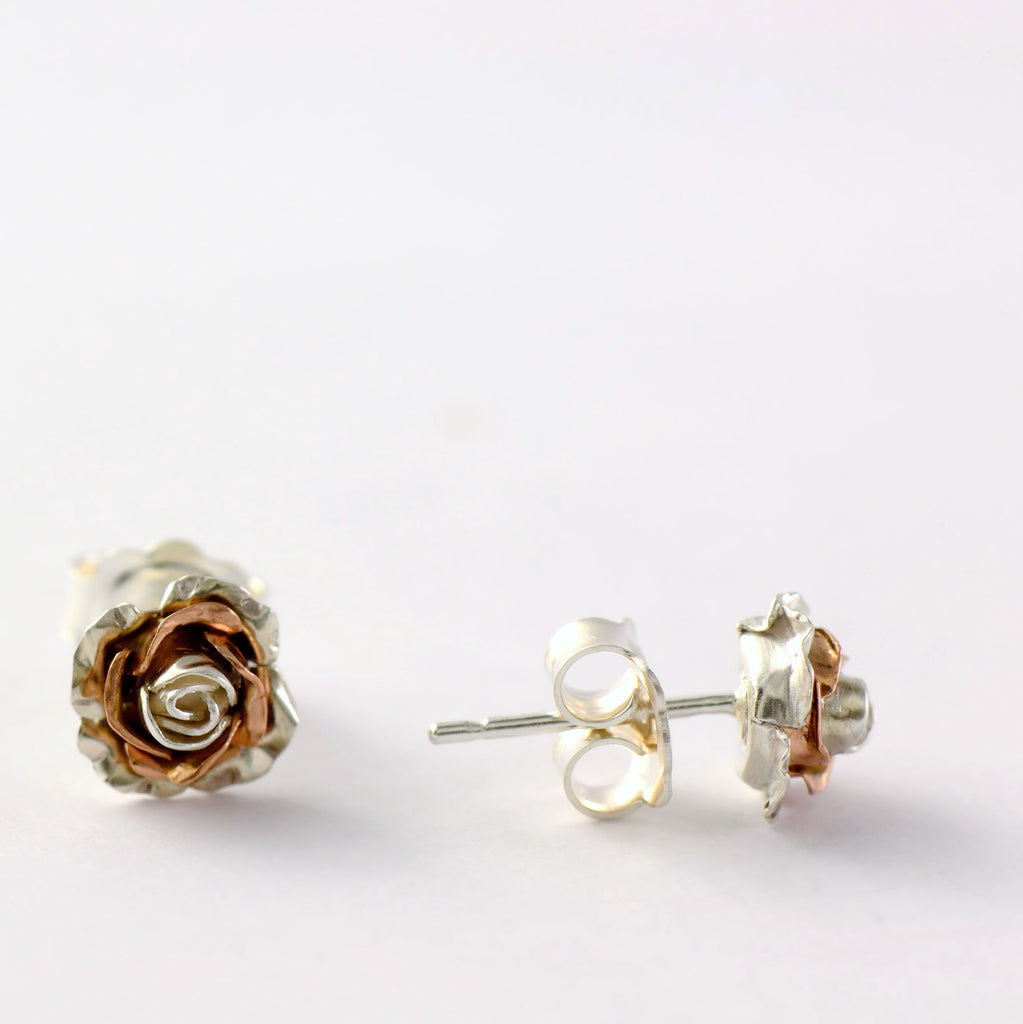 silver and rose gold rose stud earrings 