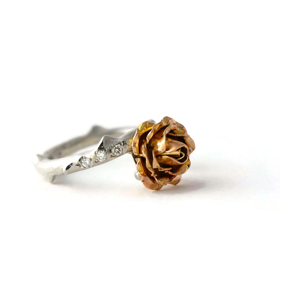 solid gold rose ring with bright small diamonds 