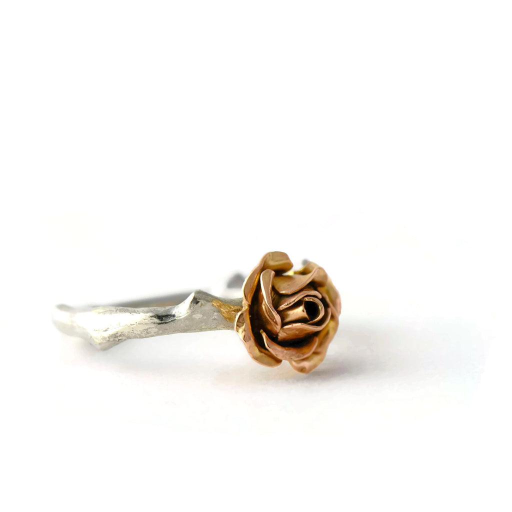 Rose gold rose ring with a silver band 