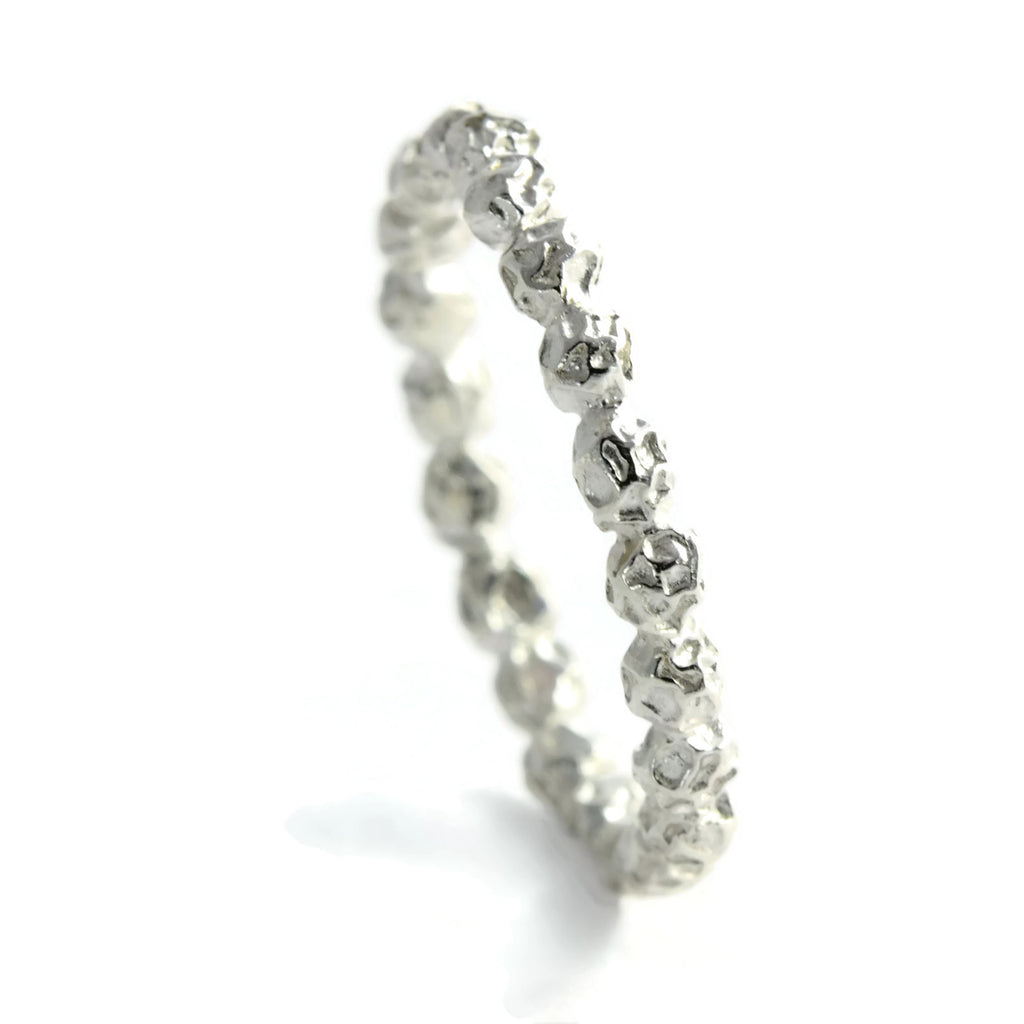 A delicate band of peppercorns ring, wedding ring.