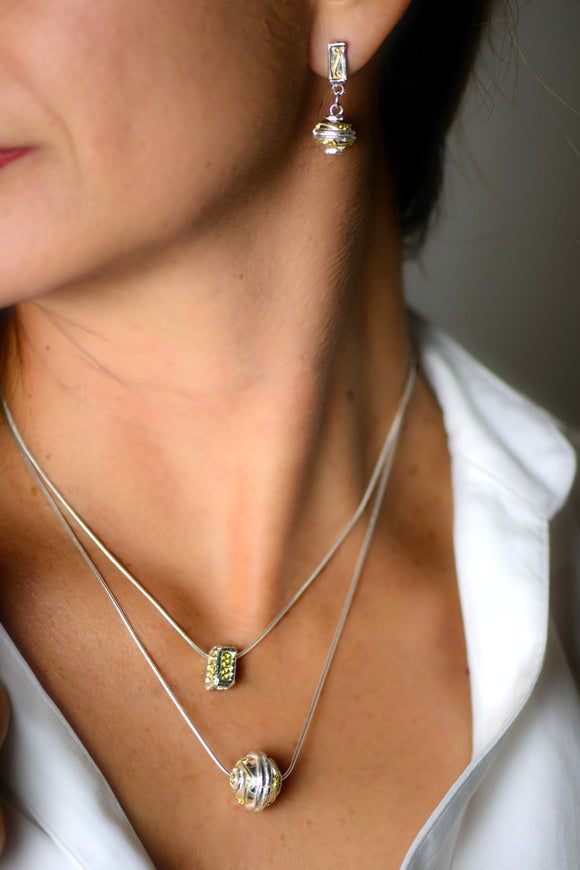 a shere pendant in 18ct gold and silver 