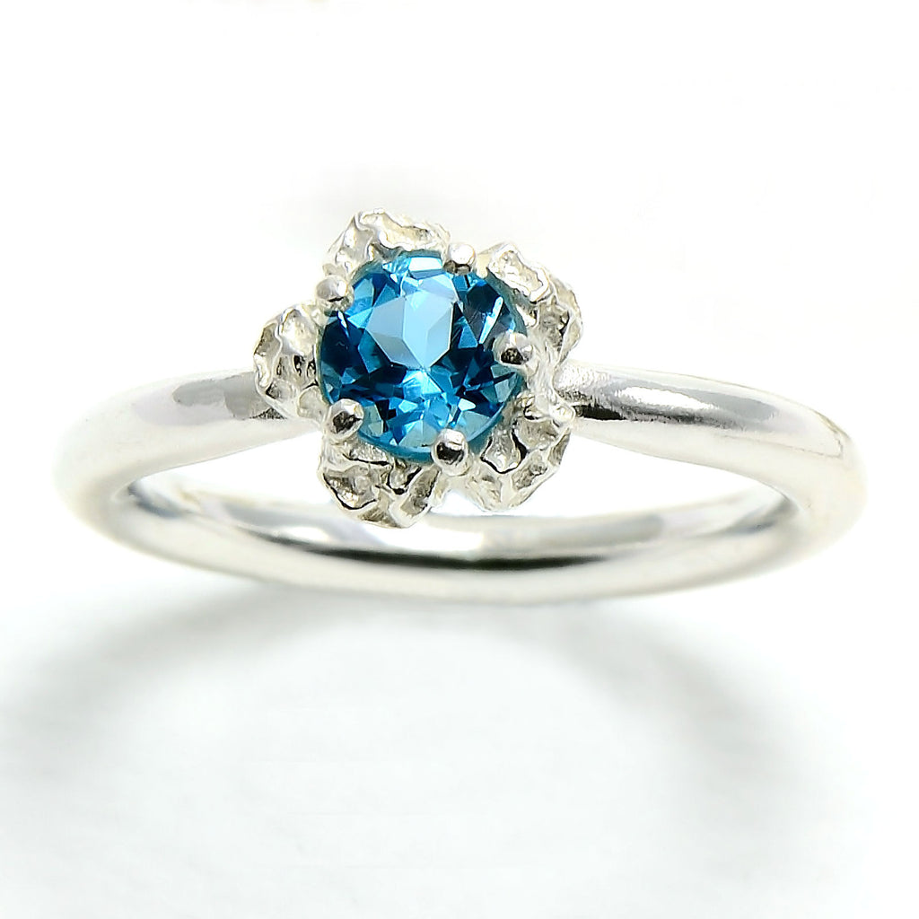 silver solitary blue topaz ring