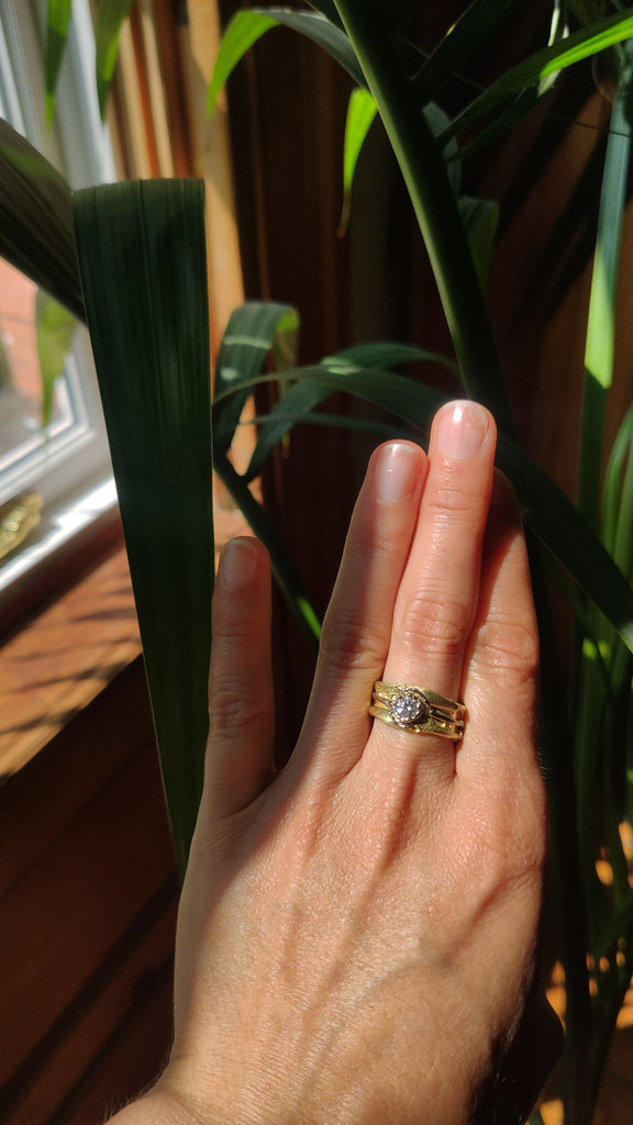 18 carat fairtrade gold ring with a bright diamond and the unique tropical insect texture