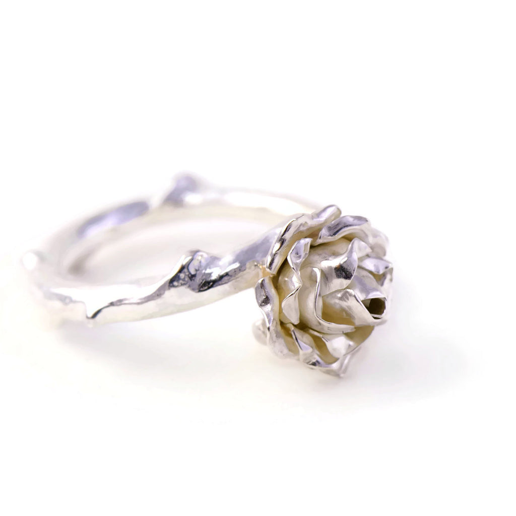 Delicate, small rose ring with a soft rose stem