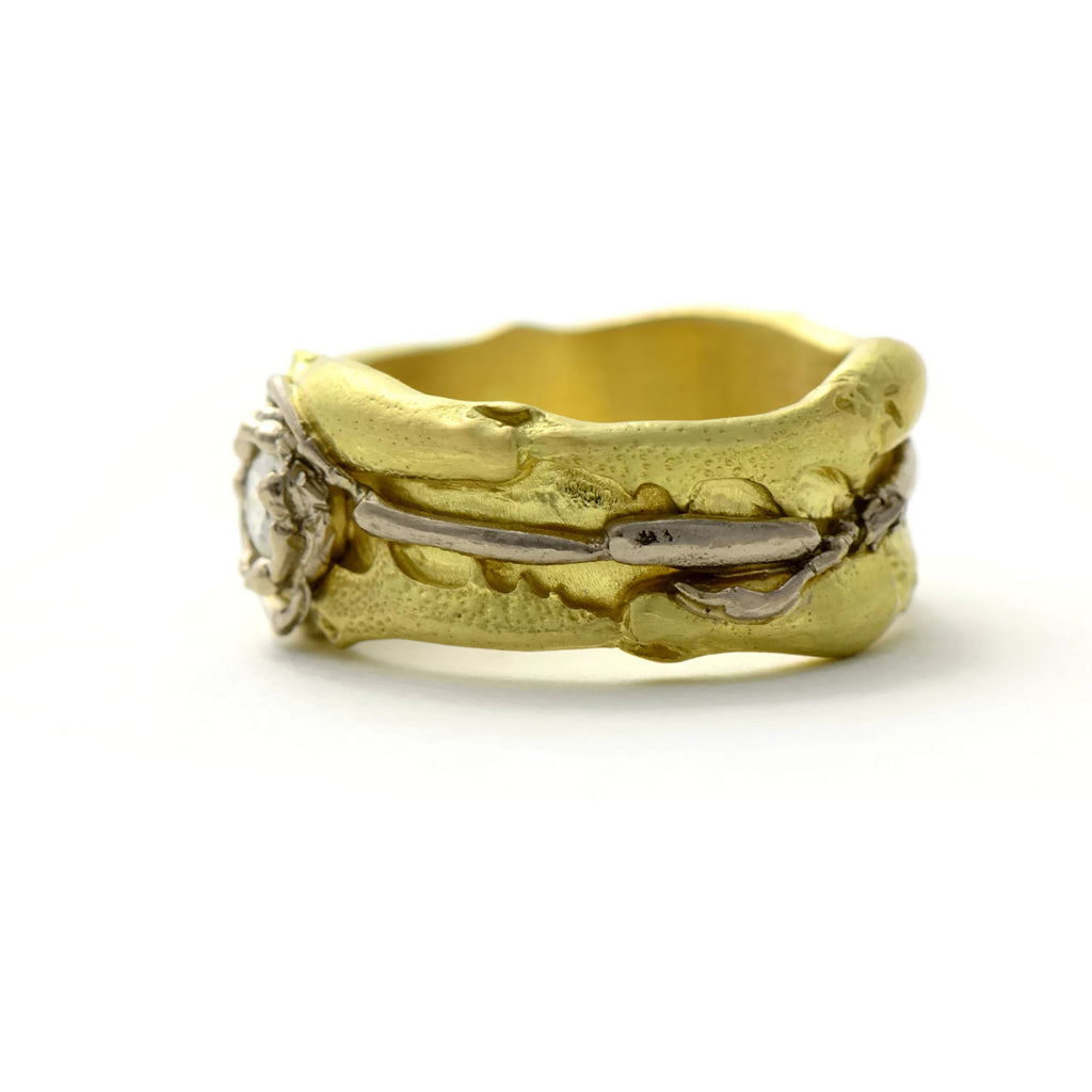 Modern unique gold ring made in 18ct gold and set with a diamond 